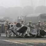 After dozens are reported dead in Kazakhstan, troops from a Russian alliance begin to deploy.