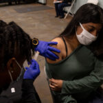 As Omicron Spreads, Officials Ponder What It Means to Be ‘Fully Vaccinated’